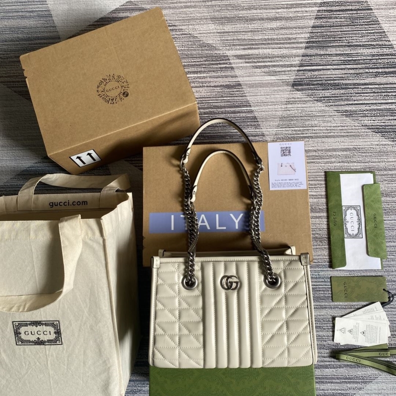 G*u*i shopping bags